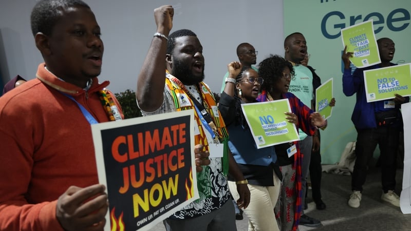 Climate activists outside the talks venue in Azerbaijan's capital Baku