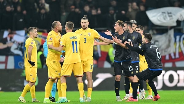 Kosovo and Romania players argue before leaving the pitch