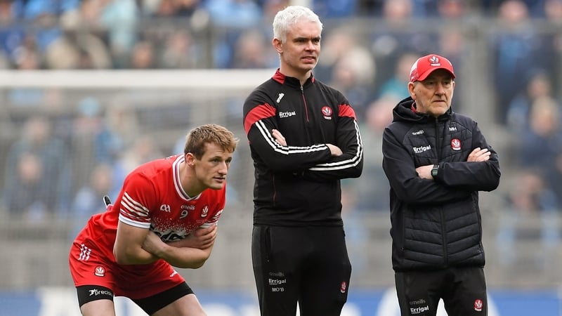 Brendan Rogers (L) watching Derry's Allianz Football League Division 1 penalty shootout victory over Dublin with selector Murtagh O'Brien (C) and manager Mickey Harte