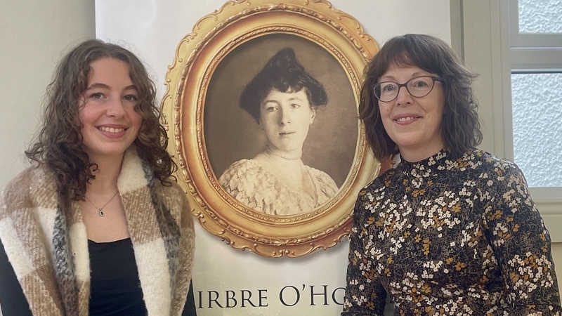 Nellie Fortune (L) and her mother Aideen Lambert, with a portrait of poet Winifred M. Letts