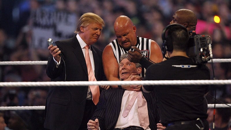 Donald Trump, Stone Cold Steve Austin and WWE wrestler Bobby Lashley get ready to shave Vince McMahon's head after McMahon lost the main event of the night in 2007