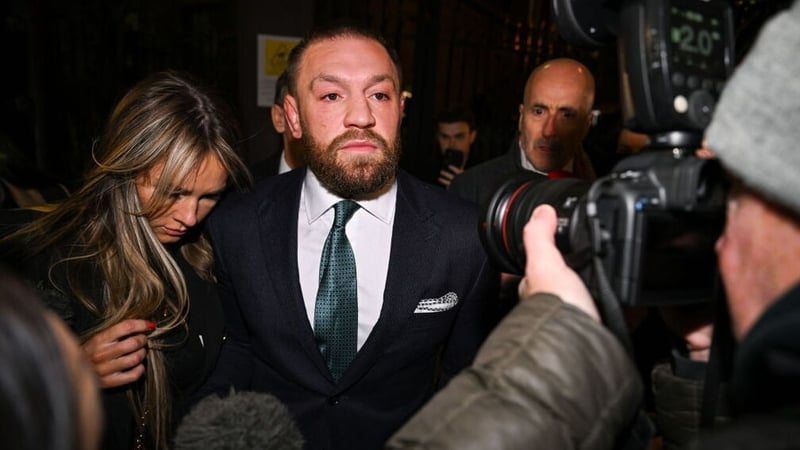 Conor McGregor leaves court, accompanied by his partner Dee Devlin