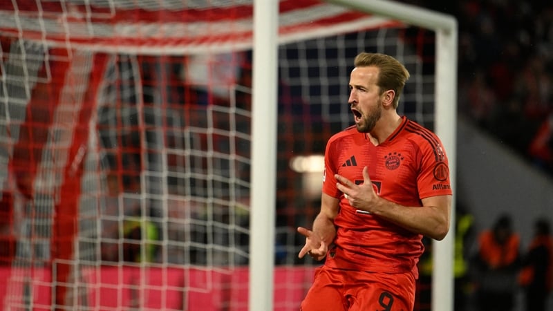 Harry Kane celebrates the first of successful penalty kicks against Augsburg