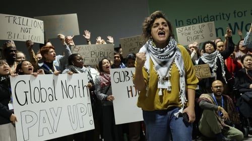 Activists protested for climate finance grants for poor countries as negotiators had walked out of overtime consultations on a climate deal