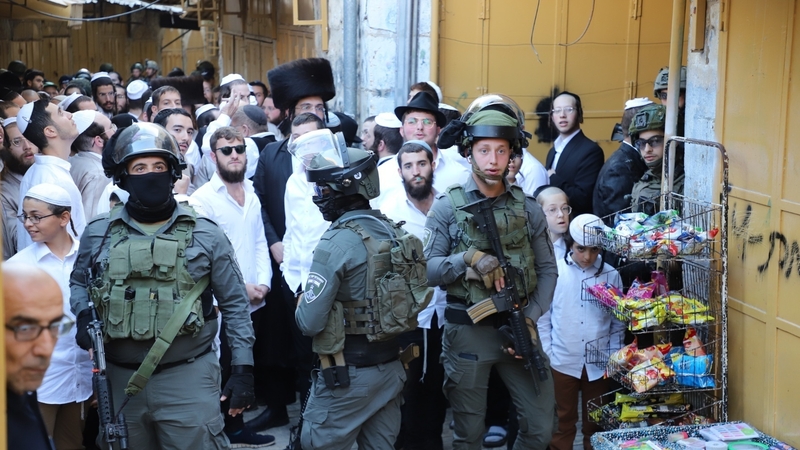Israeli forces protecting Jewish settlers who want to visit a historical site in Hebron