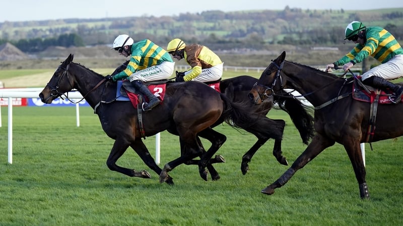 Fact To File leads Galopin Des Champs and Spillane's Tower in the closing stages of the feature at Punchestown