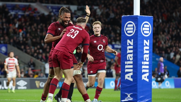 Tom Roebuck celebrates scoring England's ninth and final try