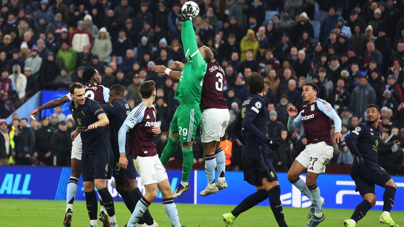 Michele Di Gregorio of Juventus is fouled by Diego Carlos of Aston Villa