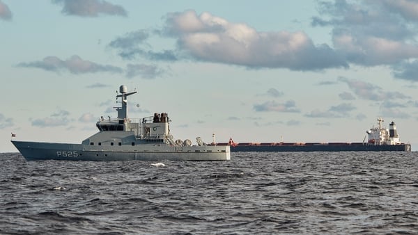 Suspicions have been directed at a Chinese ship, the Yi Peng 3 (R), which is pictured being monitored by a Danish naval patrol vessel in the sea of Kattegat