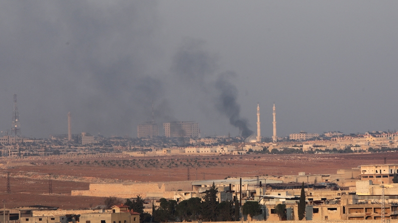 Smoke rising during clashes between jihadists and Syrian soldiers in the northern city of Aleppo