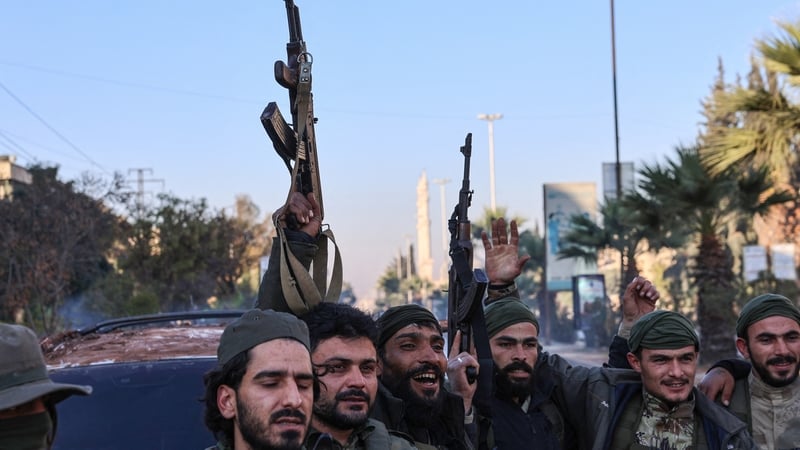 Anti-government fighters celebrate in Aleppo, after jihadists and their allies entered the northern Syrian city