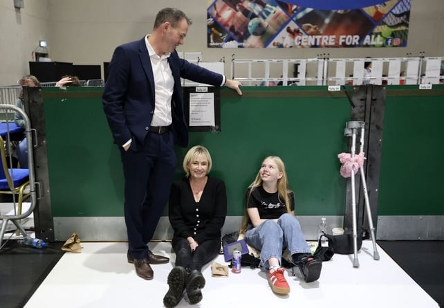 John Brady's wife Gayle and daughter Crola Brady, 12, take a break