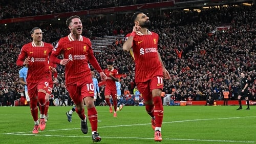 Mo Salah (R) celebrates wrapping up the points