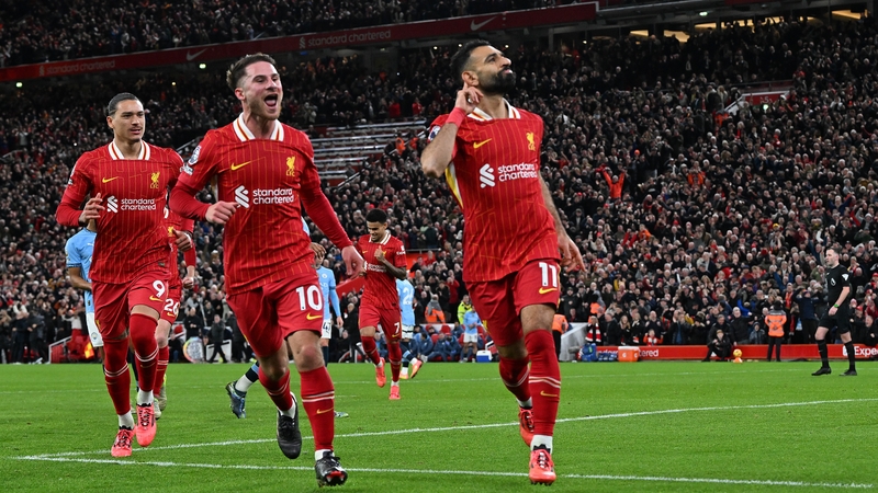 Mo Salah (R) celebrates wrapping up the points