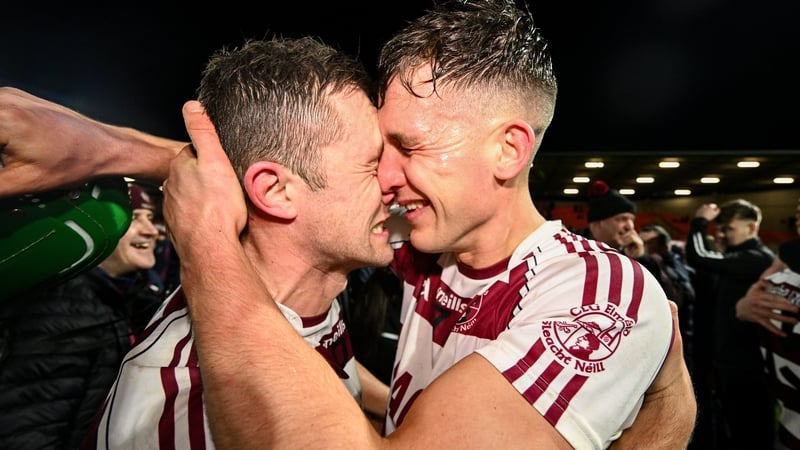 Mark McGuigan, left, and Shane McGuigan celebrate Slaughtneil's comeback win over Portaferry