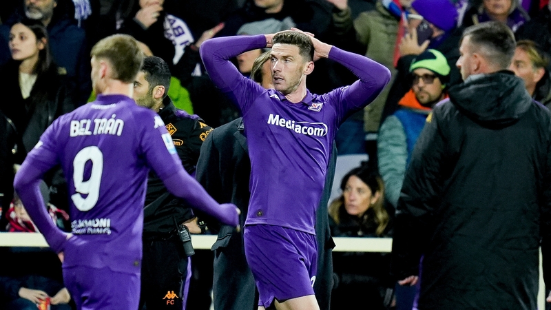 Robin Gosens of Fiorentina reacts as team-mate Edoardo Bove receives medical attention