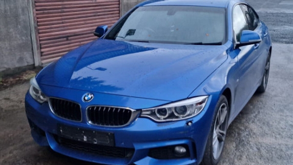 Four vehicles were seized, including a high performance blue BMW (above)