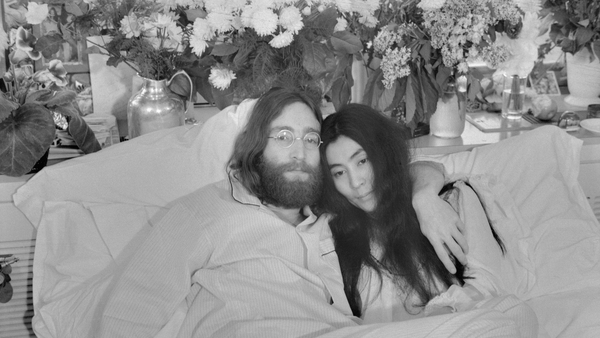 John Lennon and Yoko Ono, his bride of three months pose in bed in Montreal in June 1969
