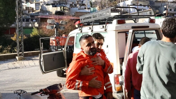 A paramedic and relatives of a person who died in the attack carried out by the Israeli army on the town of Shebaa