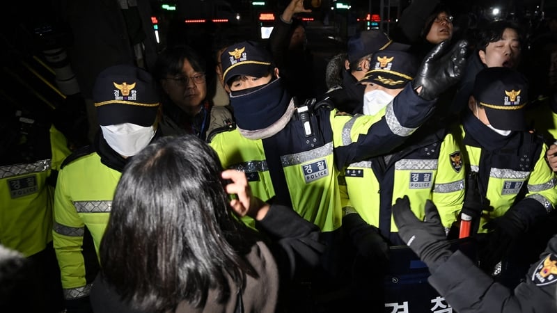 Police in front of the main gate of the National Assembly in Seoul