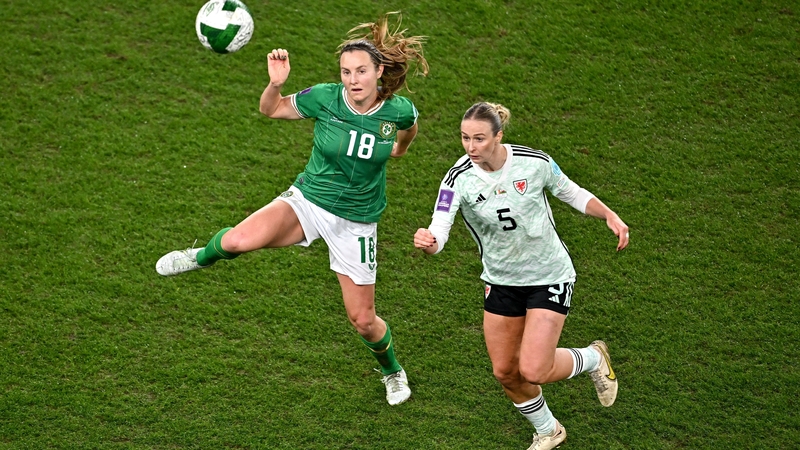 Ireland's Kyra Carusa competes for a ball with Rhiannon Roberts of Wales