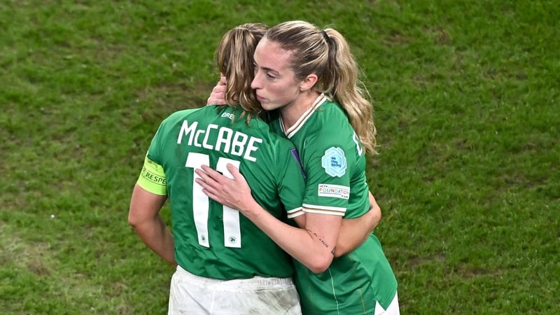 Megan Connolly (R) consoles Katie McCabe