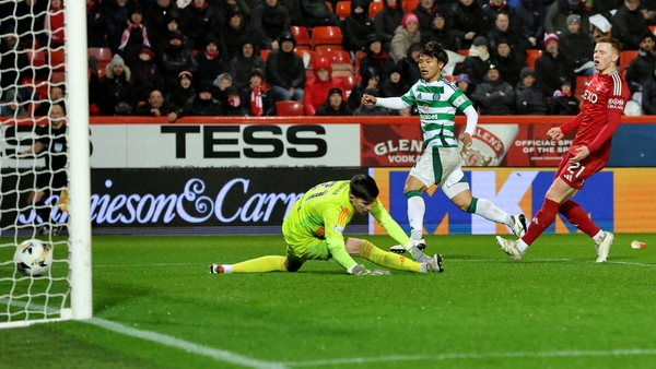 Reo Hatate watches on as his shot finds the bottom corner of Ross Doohan's goal