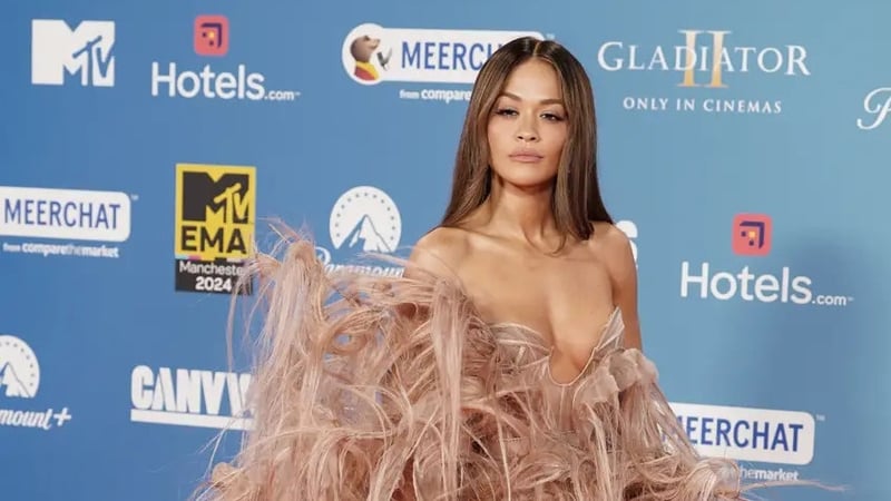 Rita Ora wore a light brown feathered gown to the EMA awards in November (Ian West/PA)