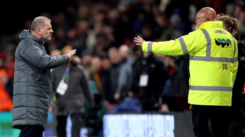Ange Postecoglou approaches a cohort of Spurs fans after the final whistle at the Vitality Stadium