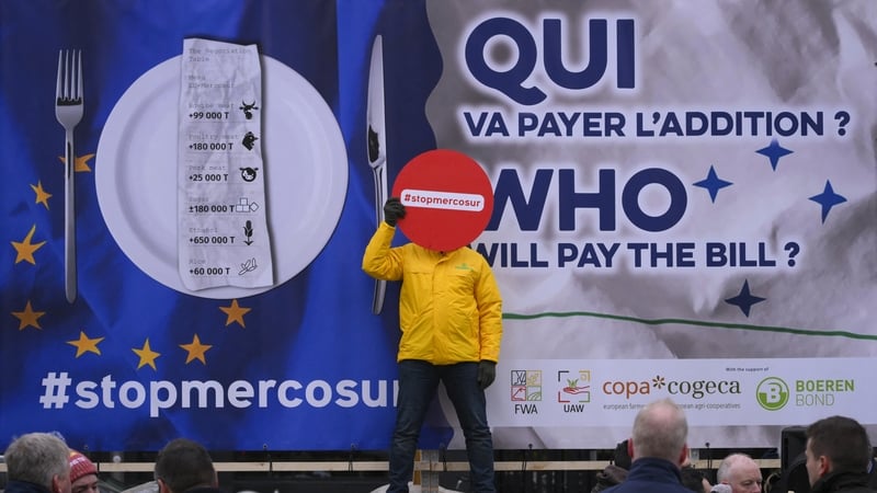 President of the Italian Young Farmers' Organisation Enrico Parisi holds a sign reading 'Stop Mercosur' during a protest in Brussels