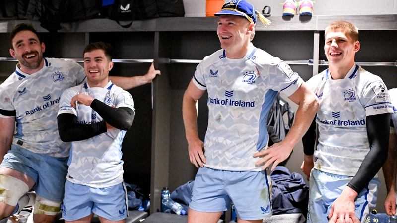 Jordie Barrett (2r) in the Leinster dressing room after making his debut