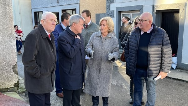 Minister of State Kieran O'Donnell (2L) said work is under way to prevent future flooding