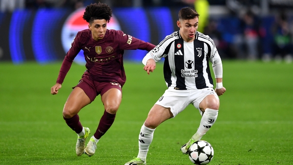 Francisco Conceicao of Juventus controls the ball under pressure from Rico Lewis of Manchester City