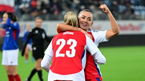 Alessia Russo celebrates scoring her team's third goal with Katie McCabe