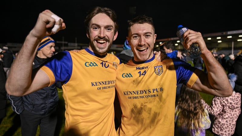 Ciarán Stacey and late match-winner AJ Murphy celebrate after full-time