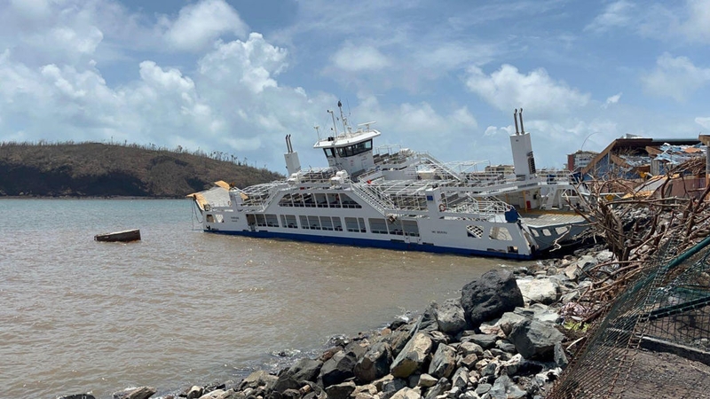 An inter-island barge stranded among debris in Mamoudzou after the cyclone Chido hit France's Indian Ocean territory of Mayotte
