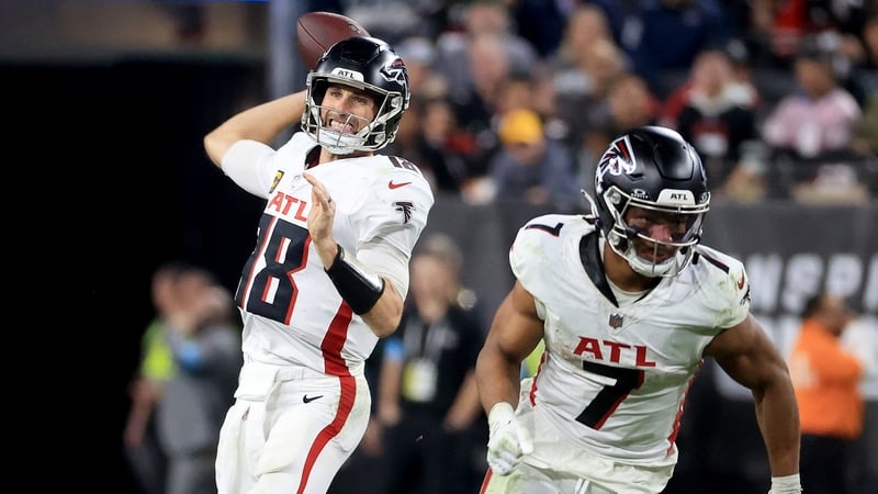 Kirk Cousins (L) of the Atlanta Falcons throws a pass against the Las Vegas Raiders at Allegiant Stadium