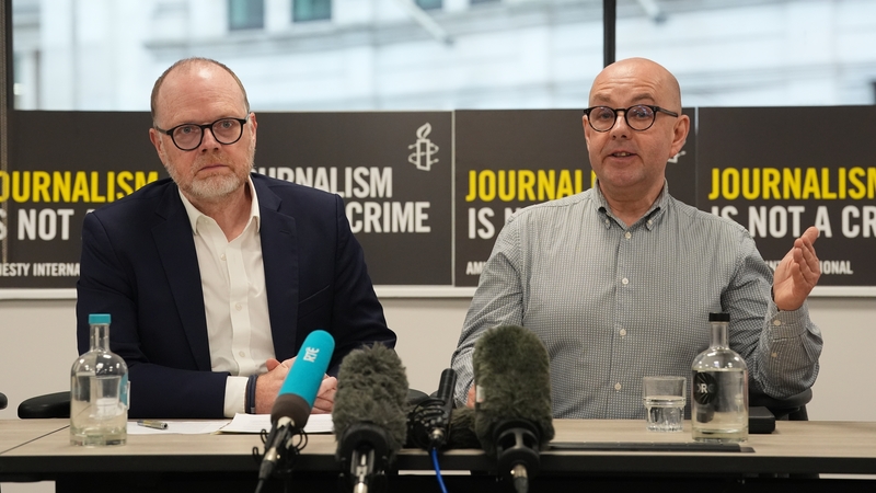 Journalists Trevor Birney (L) and Barry McCaffrey during a press conference with charity Justice at the International Dispute Resolution Centre in London