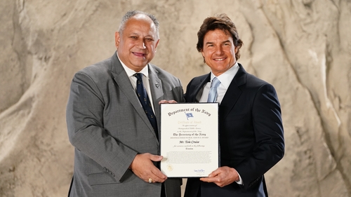 Tom Cruise is presented with the US Navy Distinguished Public Service Award by US Secretary of the Navy, Carlos Del Toro, during a ceremony at Long Cross Studios in Chertsey, Surrey. Photo credit: Ian West/PA Wire