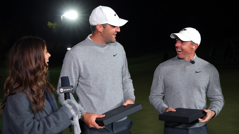 Rory McIlroy and Scottie Scheffler celebrate their victory as the darkness set in in Las Vegas