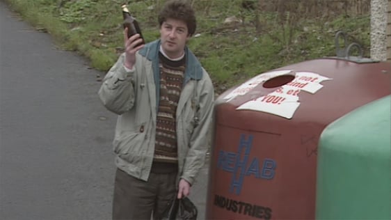 Seán Ó Méalóid recycles bottle at a recycling bank in 1990.