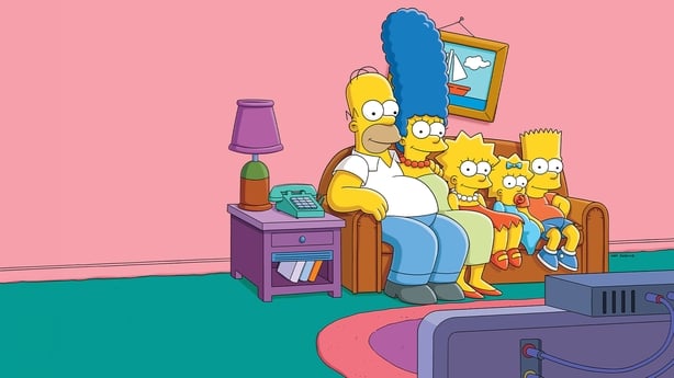 The Simpsons sitting on the couch