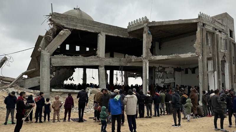 Palestinians gather to perform Friday prayers at the partially destroyed Muhammad Nasruddin al-Albani Mosque, in Khan Younis