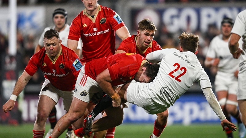 Munster's Niall Scannell tackles Ulster's Jack Murphy