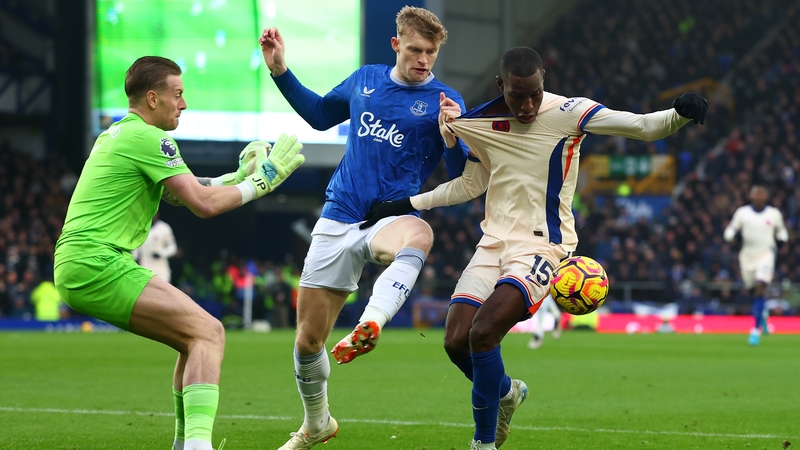 Jordan Pickford (L) and Jarrad Branthwaite close down Chelsea's Nicolas Jackson at Goodison Park