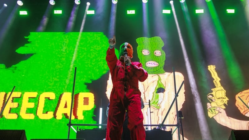 Phones at the ready - Kneecap take to the stage