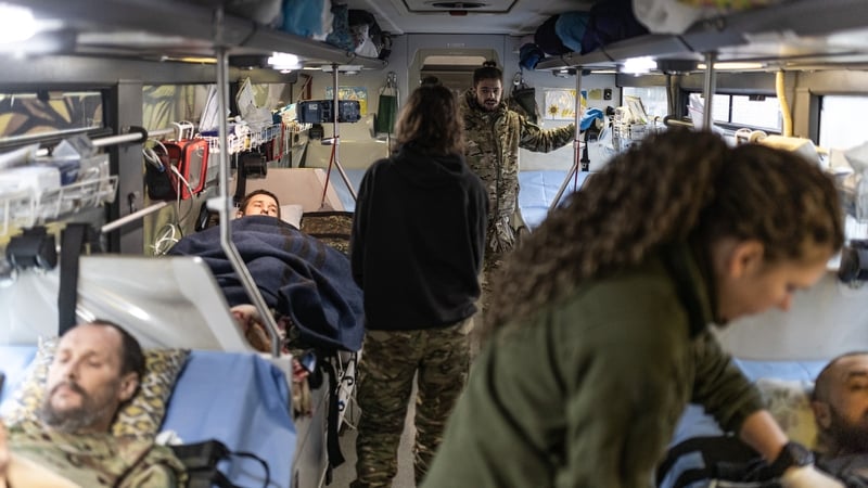 Ukrainian army paramedics treat injured Ukrainian soldiers in a bus on the frontline in Donetsk earlier this month