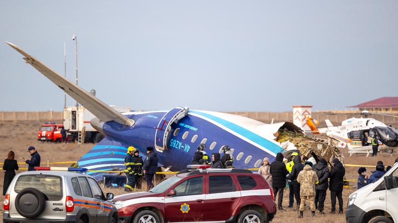 Emergency specialists work at the crash site of an Azerbaijan Airlines passenger jet near the western Kazakh city of Aktau