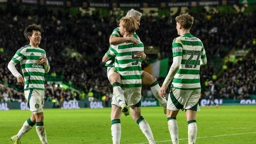 Liam Scales celebrates Celtic's second with goalscorer Daizen Maeda