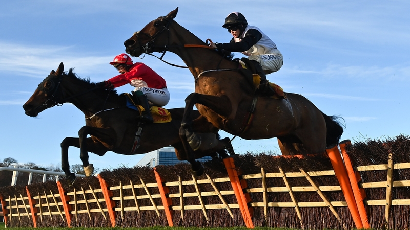 Home By The Lee (L) with JJ Slevin up, jumps the last alongside Bob Olinger, with Rachael Blackmore up, on their way to winning the Savills Hurdle